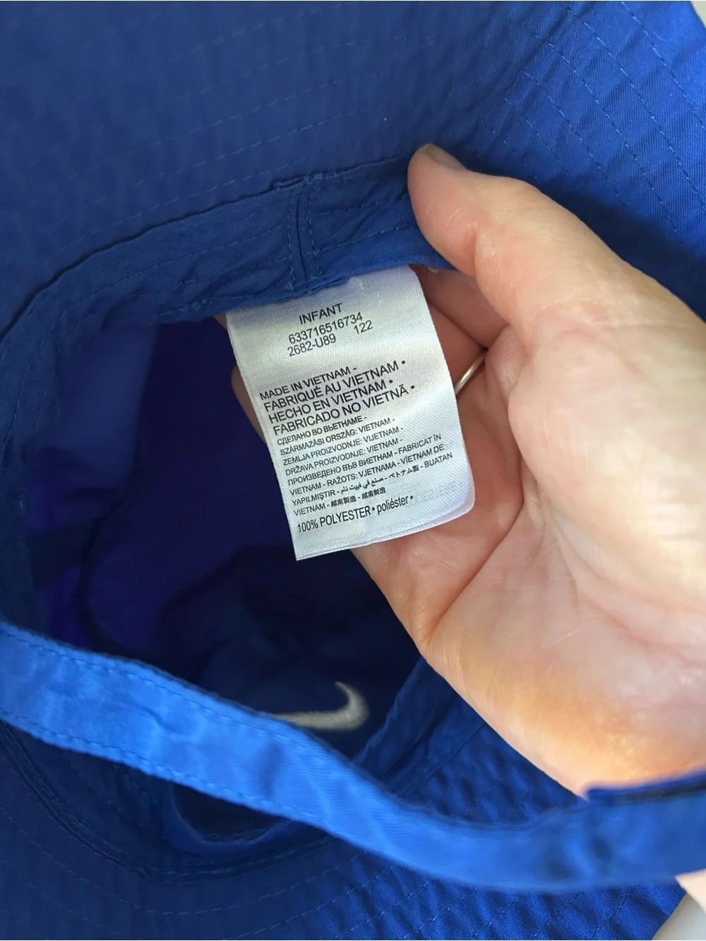 Infant blue Nike bucket hat with Velcro neck strap UPF 40+